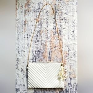 White faux leather clutch purse with detachable chain strap. 12" x 8"
